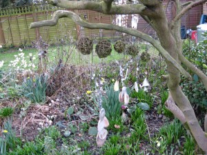 Memory Windchime made with a branch, shells, wire and hazel